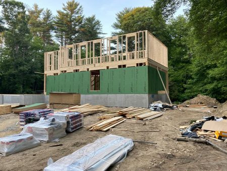 House construction with framed upper floor and foundation visible