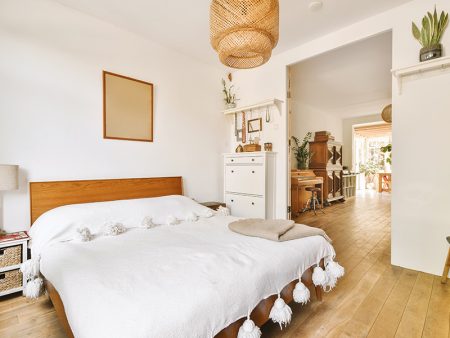 Light bedroom with wooden wardrobe
